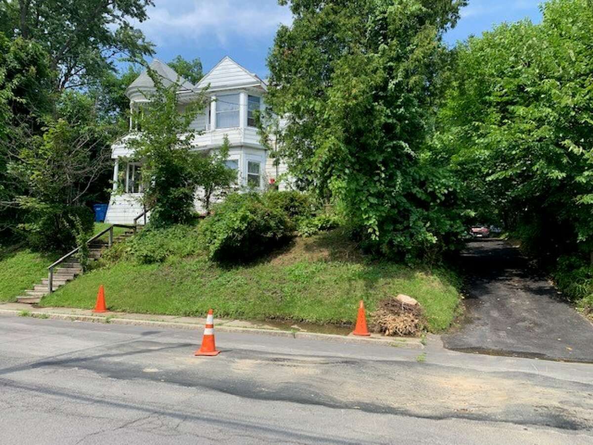A home at 927 Mercer St. in Albany leaks water from an unknown location on Tuesday, July 30, 2019. (Amanda Fries / Times Union)