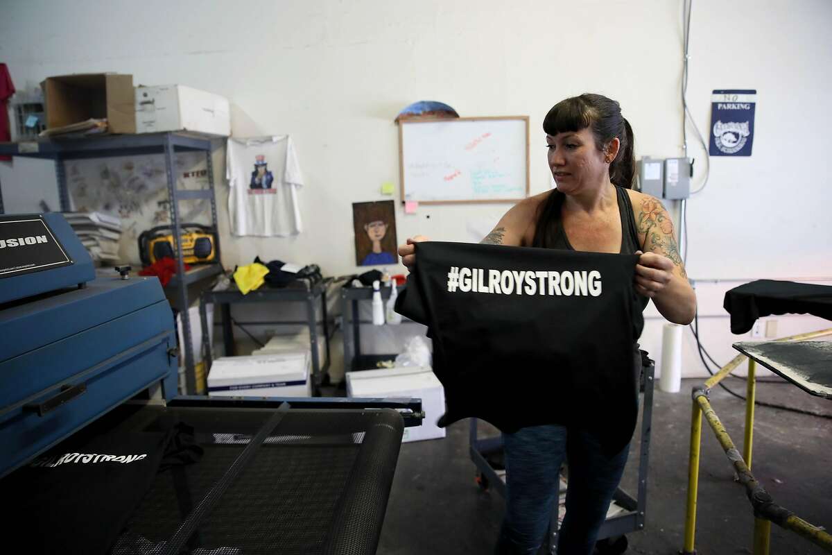 Michele Pierson, 41, co-owner of Cal Silk, makes #GilroyStrong t-shirts in Gilroy, Calif., on Tuesday, July 30, 2019. "I'm amazed by how everyone is coming together," Pierson said. "It's very heartwarming."