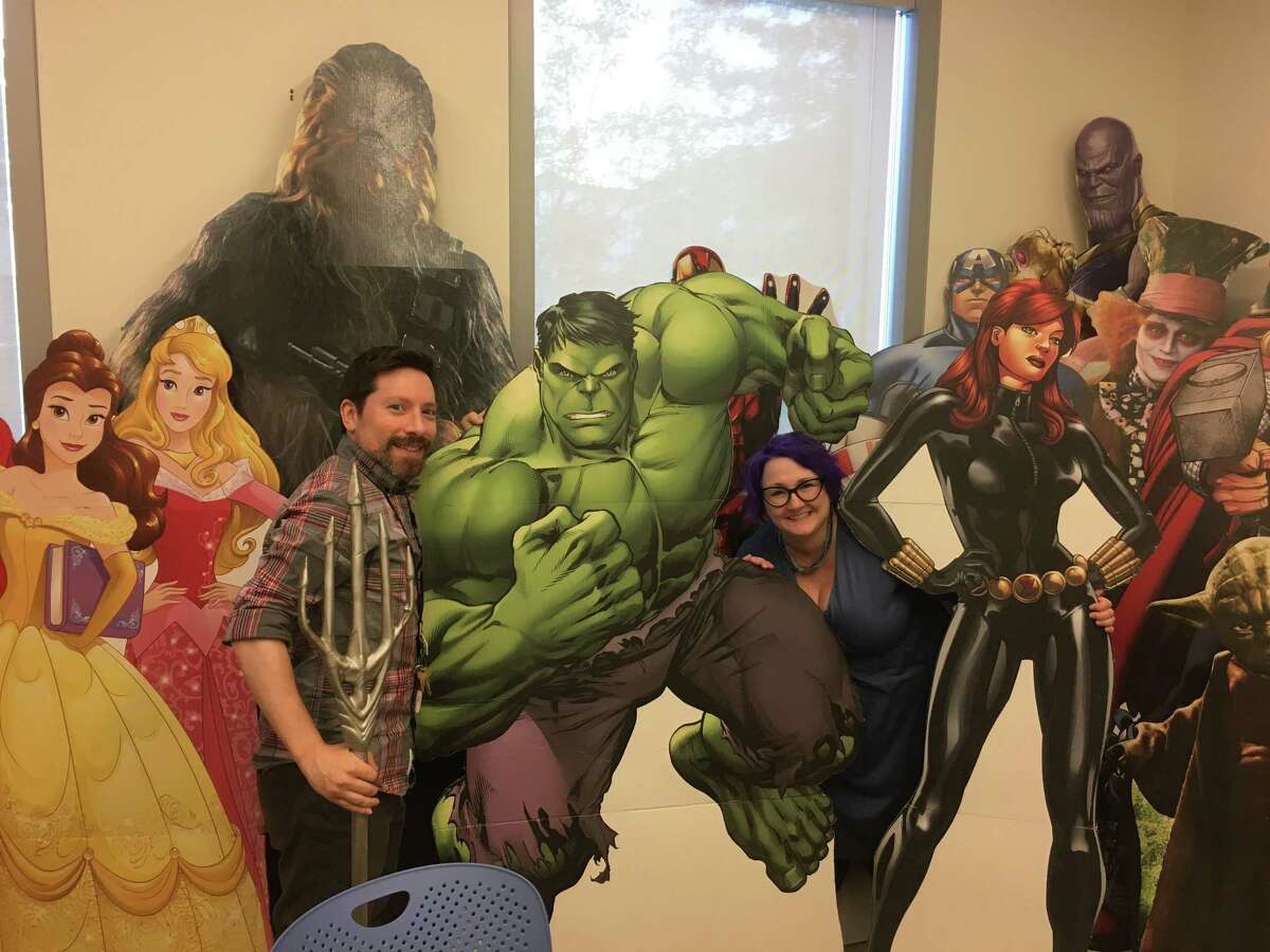 John Casiello and Kristina Lareau take a minute out of their busy days at the Ridgefield Library to take a picture next to a cardboard cutout of The Hulk. Casiello is the library’s adult collection specialist and Lareau is the head of children’s services. The duo have been busy organizing the fifth annual RidgeCon event Aug. 9 and Aug. 10 at the library. The library’s 50 or so pop culture cutouts range from Yoda to Harry Potter to Disney princesses to the cast of The Walking Dead to Dr. Who.