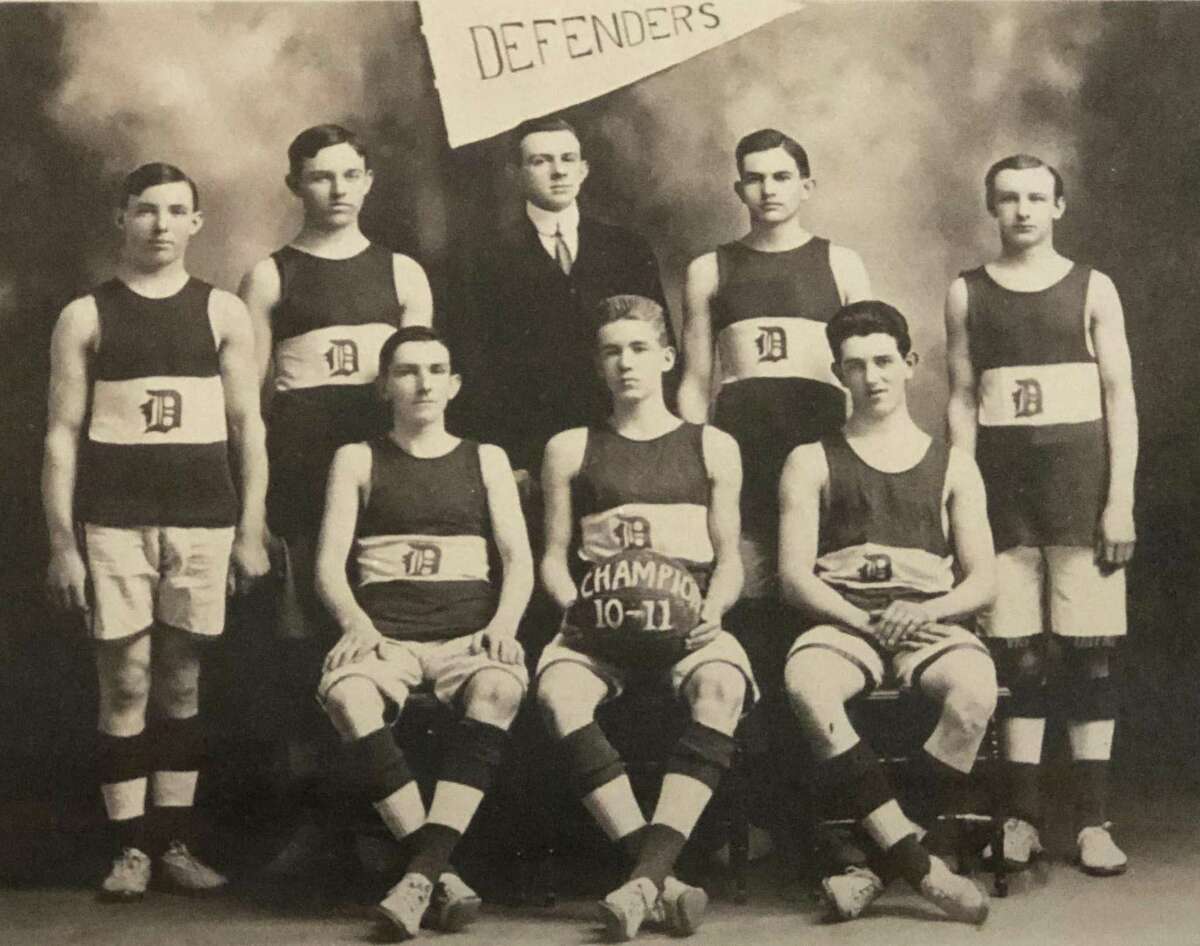 The Defenders basketball team played for many years on the second floor of the town hall in New Milford before the court came to town hall and divided the space to multiple rooms. The 1910-11 team was made up of, from left to right, in front, Michael M. Hastings, James R. Hulton and Victor Moore, and in back, standing, E. Paul Martin, William X. Martin, J. Leo Murphy (player-manager), Martin Manion and Bert Emro. If you have a