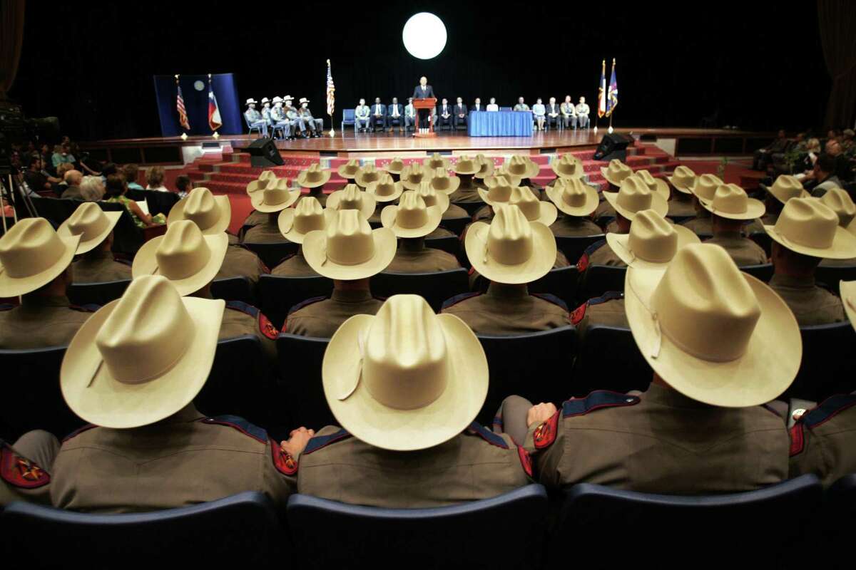 One-hundred twenty new state troopers listen to Col. Thomas A. Davis, Jr., director of the Texas Department of Public Safety Recruit School give closing remarks during the graduation ceremony at Shoreline Christian Center in Austin, Texas Friday, Aug. 5, 2005. (AP Photo/The Dallas Morning News, Erich Schlegel)
