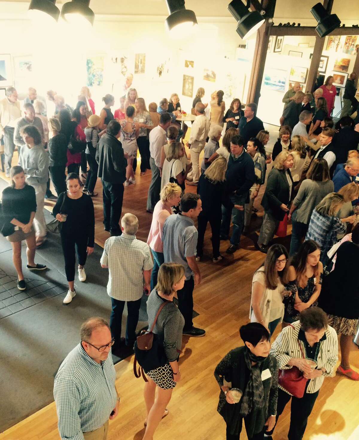 A packed Carriage Barn Arts Center at the opening of a previous New Canaan Society for the Arts Members Show. This year's opening reception is set for Sunday, Sept. 8. Artists have until Friday, Aug. 16, to submit works.