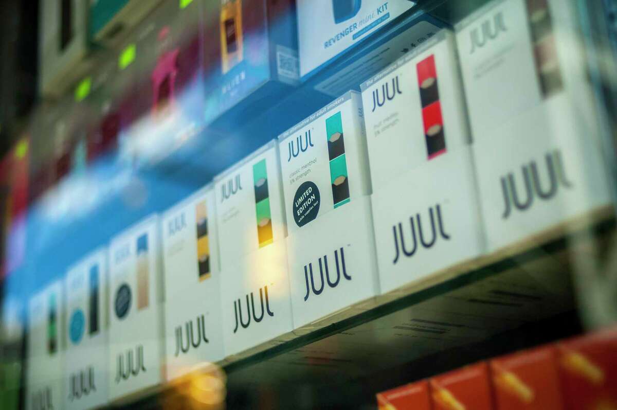 A selection of the popular Juul brand vaping supplies on display.