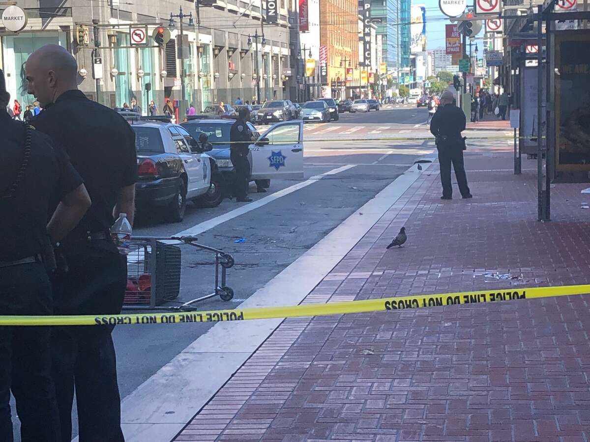 San Francisco police officers gathered on the scene at the intersection of Market St. and Fifth St. Witnesses report a dog was shot.