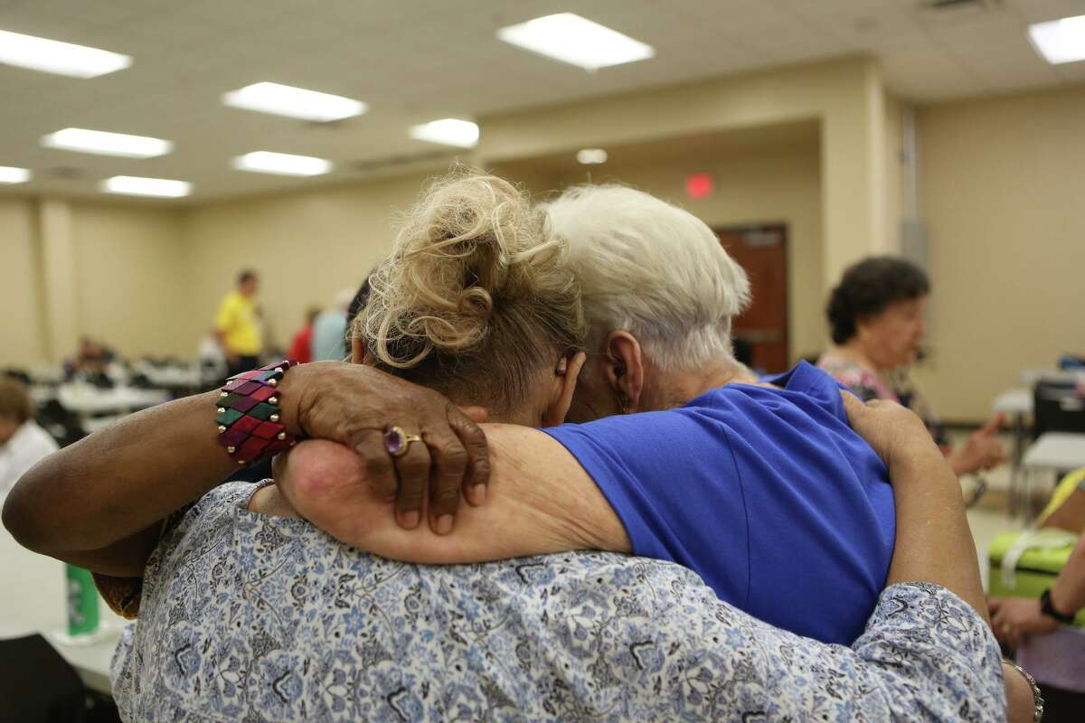 Doris Griffin embraces other women at the center named after her on July 25. Griffin, who is a lively advocate for seniors, is a frequent visitor at the Doris Griffin Senior Center.