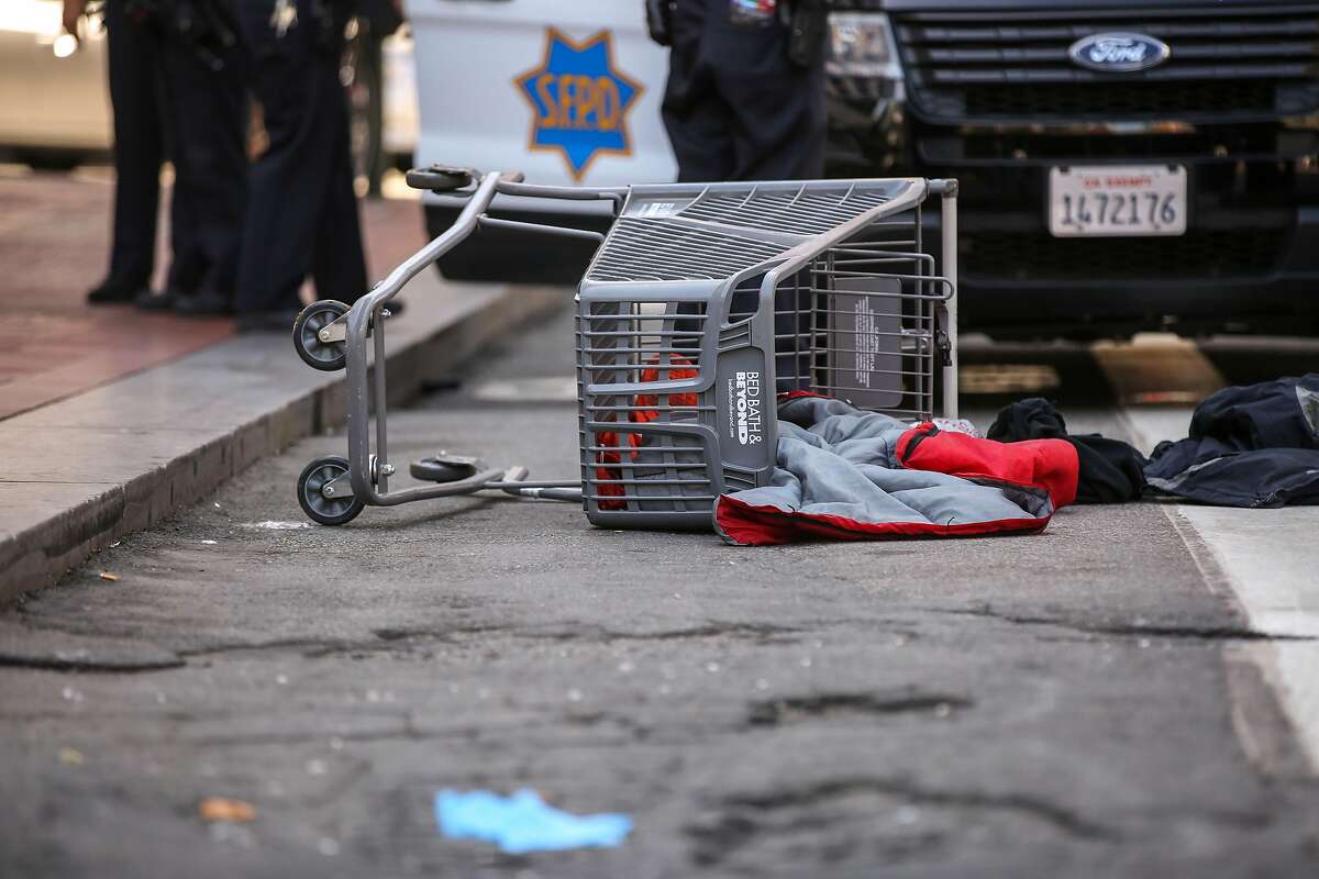 An overturned shopping cart near Market Street and 5th Street where a police officer allegedly shot a dog Wednesday, July 31, 2019, in San Francisco, Calif.