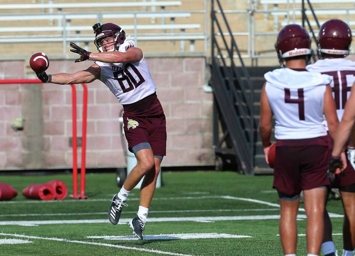 Reciever Hutch White (80) snags a pass as the Texas State Bobcats football team kicks off practice for their upcoming season under new head coach Jake Spavital. The team held practice at Bobcat Stadium on Wednesday, July 31, 2019. (Kin Man Hui/San Antonio Express-News)