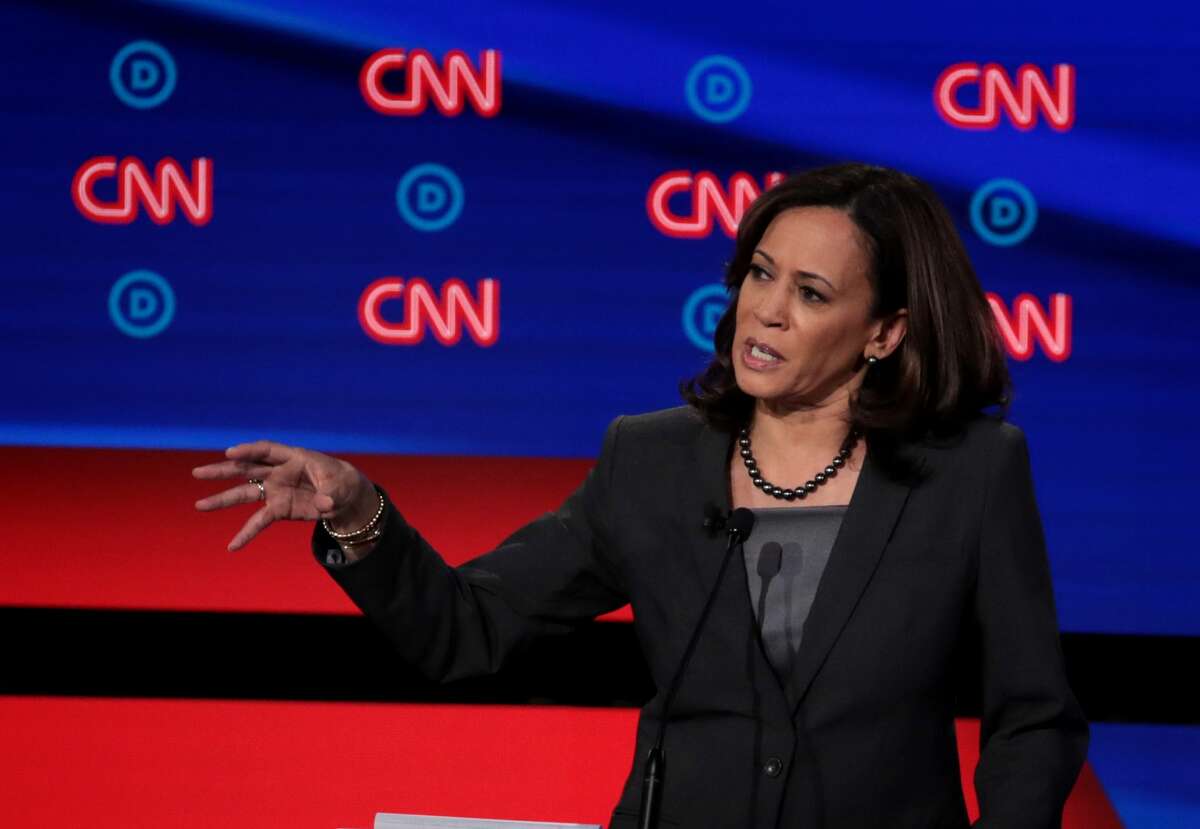 DETROIT, MICHIGAN - JULY 31: Democratic presidential candidate Sen. Kamala Harris (D-CA) (R) speaks during the Democratic Presidential Debate at the Fox Theatre July 31, 2019 in Detroit, Michigan. 20 Democratic presidential candidates were split into two groups of 10 to take part in the debate sponsored by CNN held over two nights at Detroitâs Fox Theatre. (Photo by Scott Olson/Getty Images)