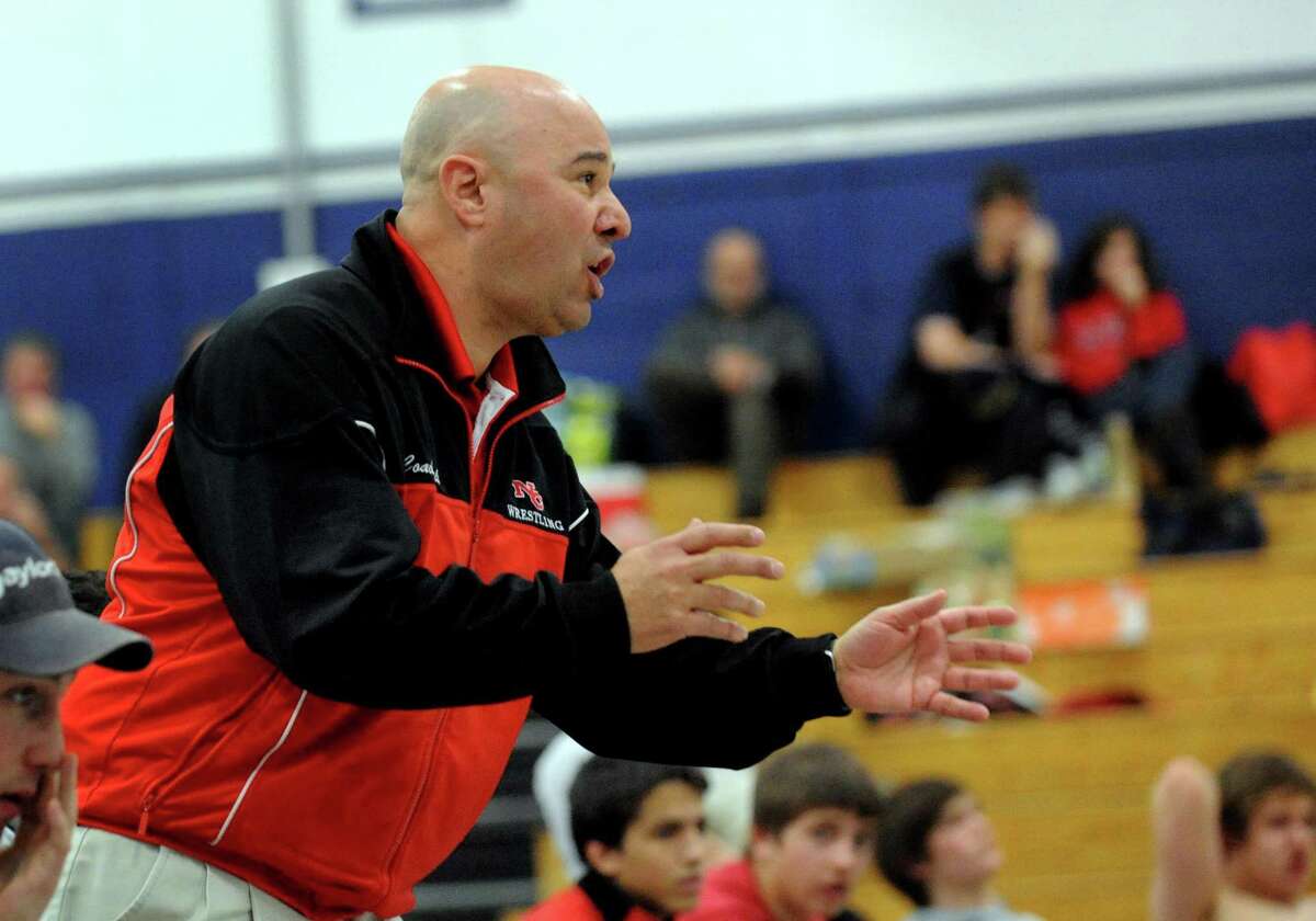 New Canaan Head Coach Paul Gallo, during wrestling meet action at Staples High in Westport, Conn. on Saturday January 22, 2011.