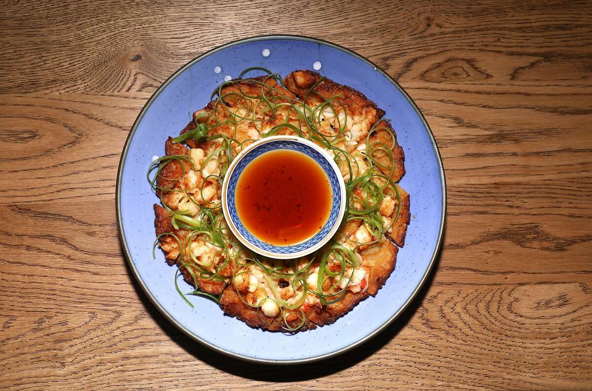 Seafood pancake--rock shrimp, scallions, um.ma soy sauce--seen at Um.ma, Chris Oh's restaurant in the Sunset dedicated to homestyle Korean cooking on Friday, July 26, 2019 in San Francisco, Calif.
