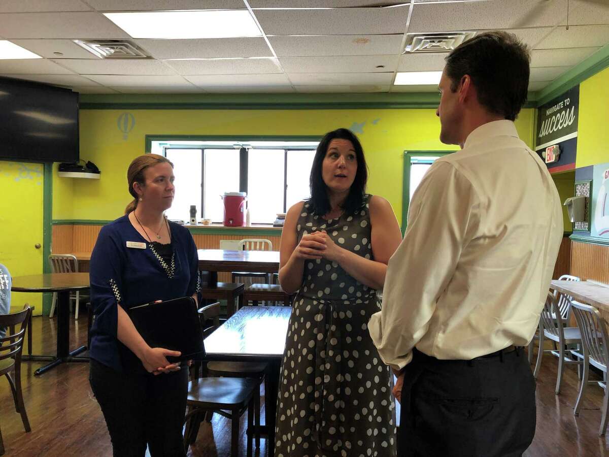 U.S. Rep. Jim Himes, D-Conn., talks with Michele Conderino, the new executive director of the Open Door Shelter on Thursday in Norwalk.