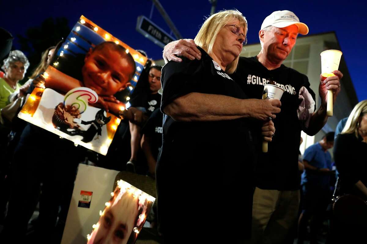 In the wake of Sunday's mass shooting at the Gilroy Garlic Festival, Paula and Bob Weaver of Gilroy take part in a candlelight vigil on Monterey Street in Gilroy, Calif., on Thursday, August 1, 2019.