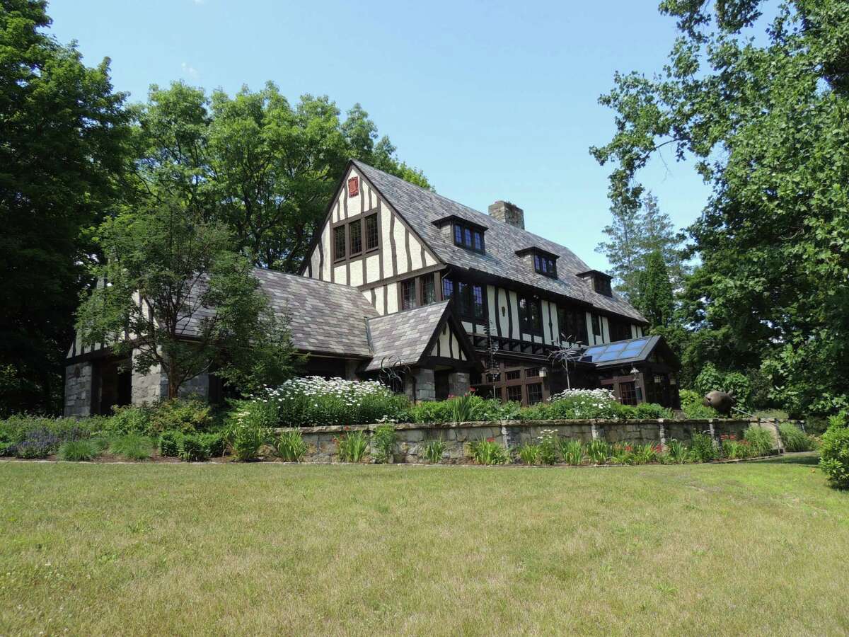 26 Mansion Dr., Copake: Circa 1920 Tudor mansion, 7,178 square feet. Six bedrooms, in-ground gunite pool, clay tennis court and landscaping. 5.2-acre lot. (Photo by Frances Ingraham Heins)