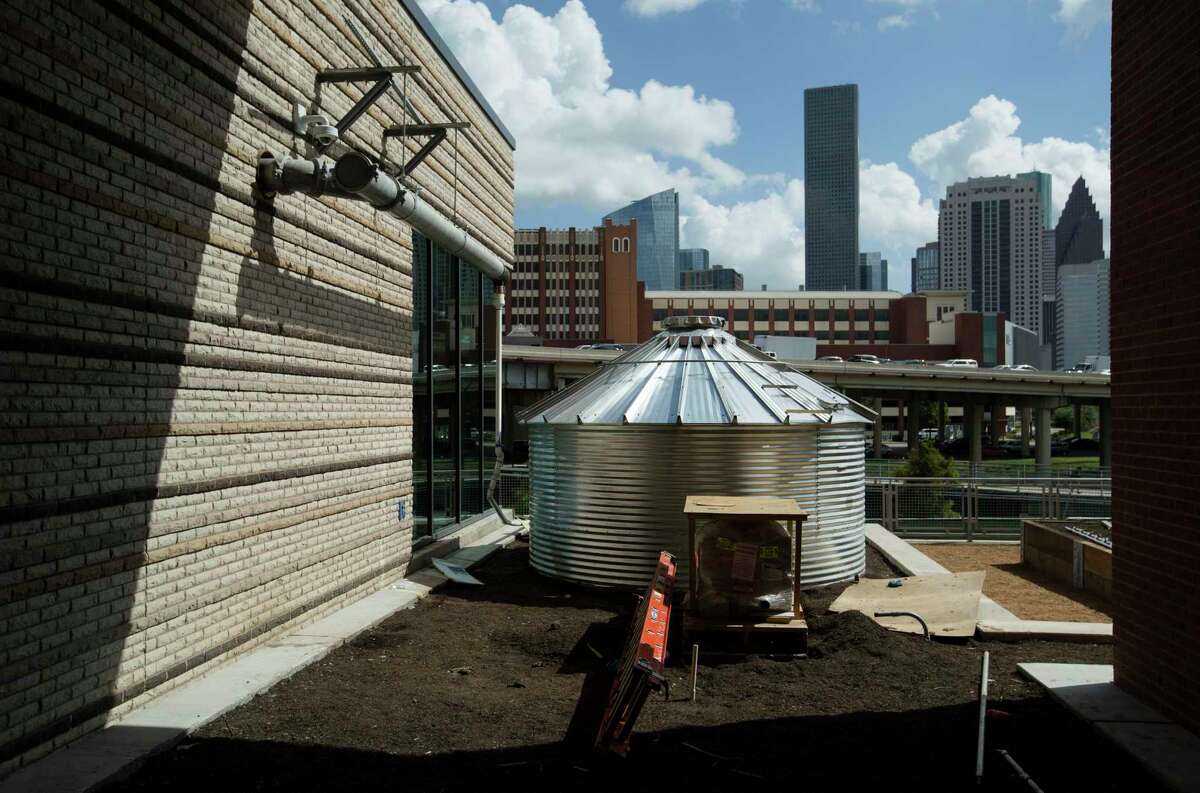 A cistern to collect rain water for seven garden beds are installed outside the University of Houston-Downtown's new College of Sciences & Technology Building on Wednesday, July 17, 2019, in Houston. The building, which mainly hosts biology and chemistry classes and labs, will begin having classes this fall. The garden beds will grow native plants and vegetables.