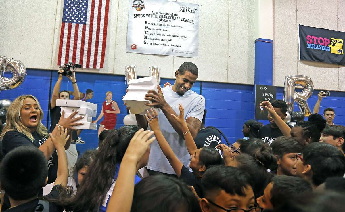 LaMarcus Aldridge is swarmed by the kids after he surprised them with I-Pads for the over 250 kids. San Antonio Spurs forward LaMarcus Aldridge will surprise students ages 6-18 with a back-to-school event on Friday, Aug. 2,2019at the Boys & Girls Club of San Antonio (BGSA)–Calderon Branch.