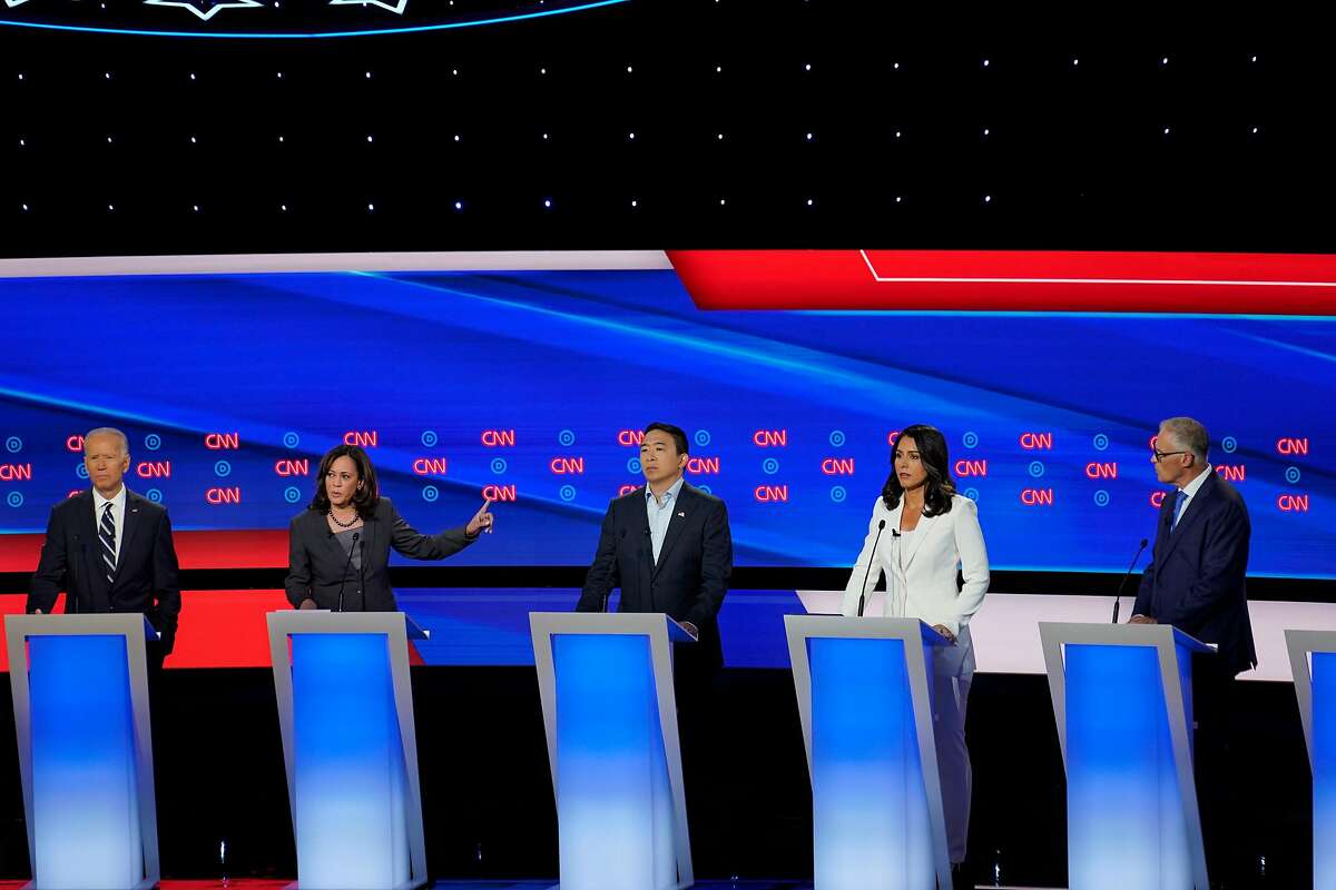 Candidates on stage during the second night of Democratic presidential debates, hosted by CNN at the Fox Theatre in Detroit, July 31, 2019. From left: Former Vice President Joe Biden; Sen. Kamala Harris (D-Calif.); Andrew Yang; Rep. Tulsi Gabbard (D-Hawaii); and Gov. Jay Inslee of Washington. (Erin Schaff/The New York Times)