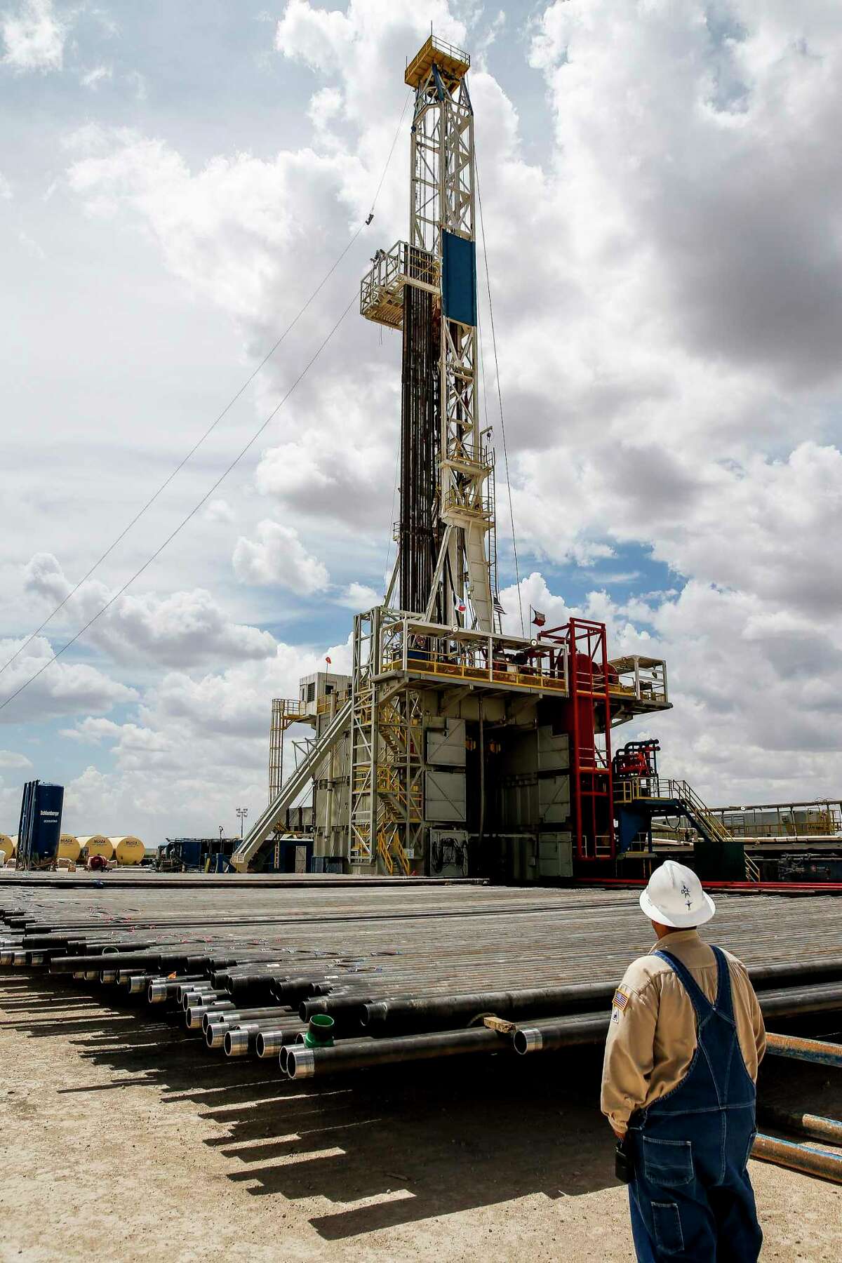 A drill rig sits on a pad site where it will drill three to six wells next to each other at a Chevron drilling and hydraulic fracturing site in the Permian Basin.