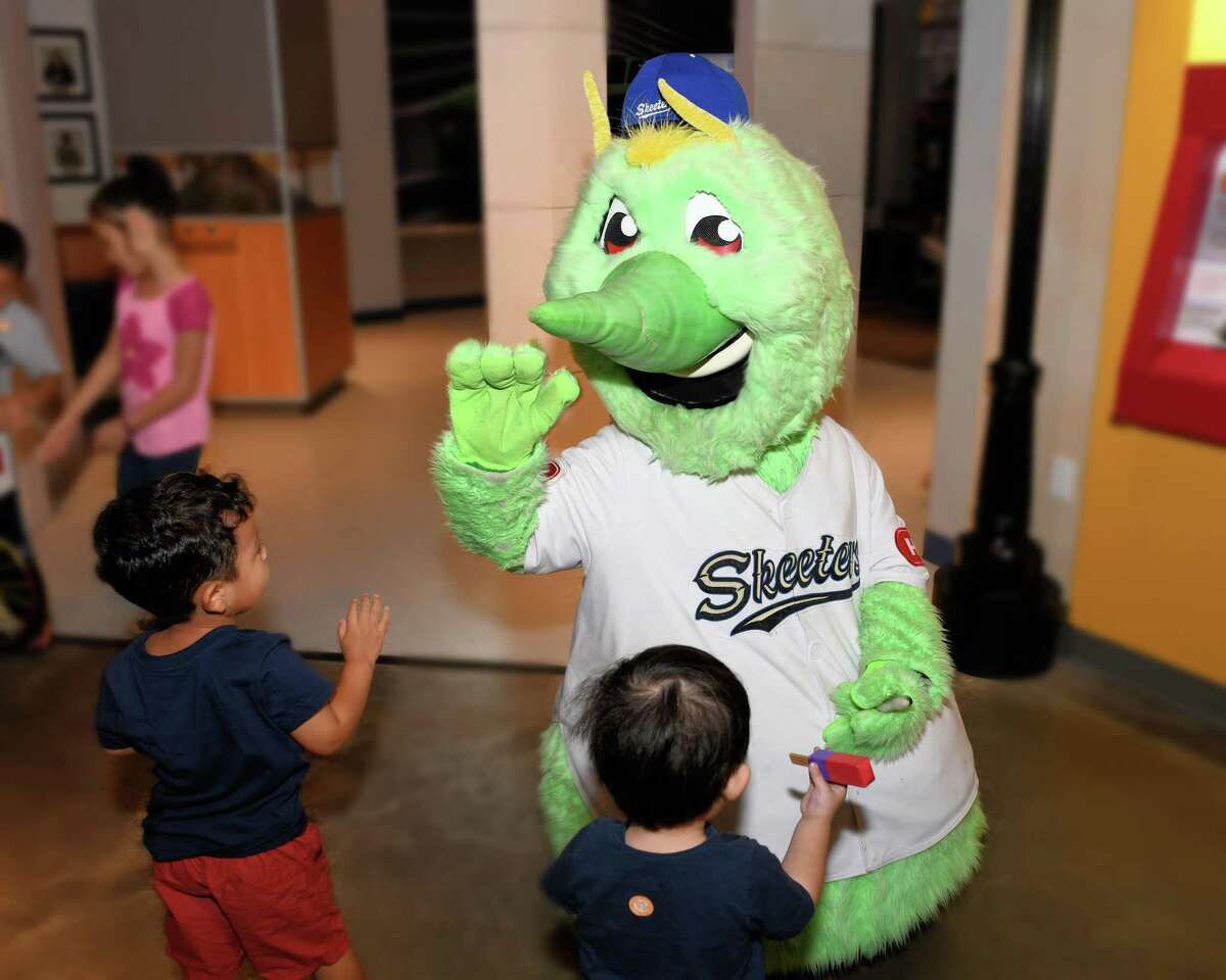 The Sugar Land Skeeters’ mascot Swatson interacts with visitors to the Fort Bend Children’s Discovery Center in Sugar Land on Friday, Aug. 2.
