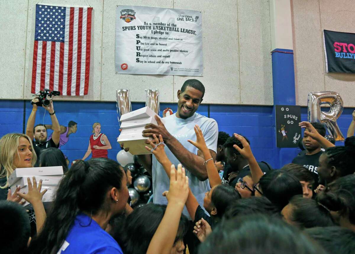 Children at the Boys & Girls Club of San Antonio swarm Spurs forward LaMarcus Aldridge back in August. The Boys & Girls Clubs of San Antonio serve about 7,300 children who depend on the clubs as places to do homework, get tutoring, and eat healthy snacks and meals.