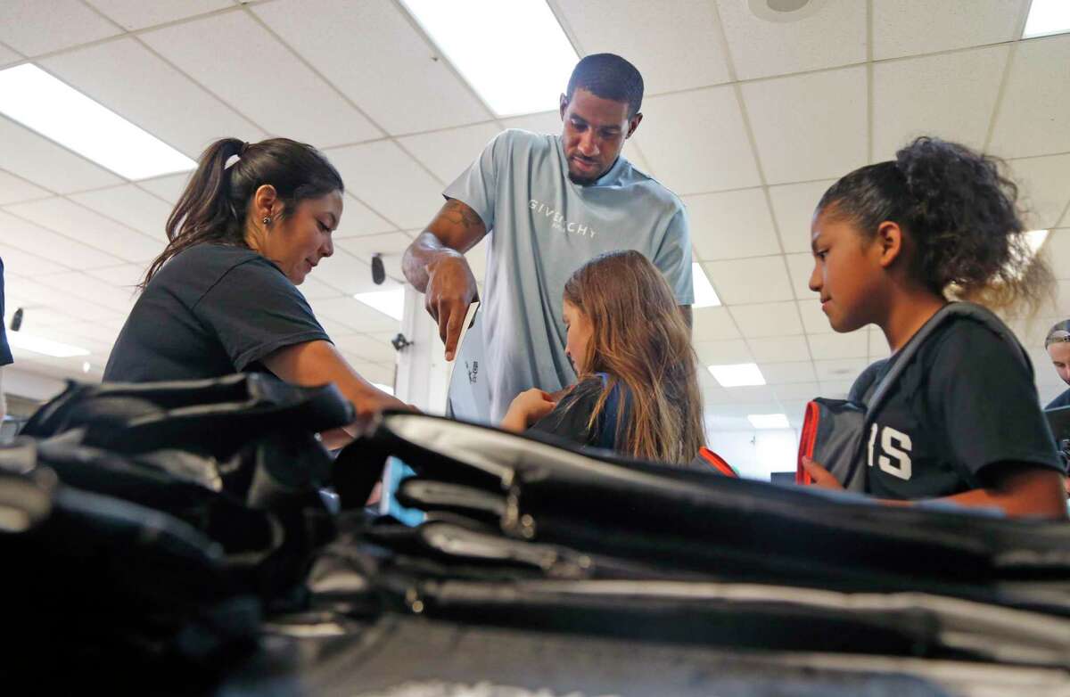 LaMarcus Aldridge fills up the back pack for each student with supplies supplied by H.E.B. San Antonio Spurs forward LaMarcus Aldridge will surprise students ages 6-18 with a back-to-school event on Friday, Aug. 2,2019at the Boys & Girls Club of San Antonio (BGSA)-Calderon Branch.