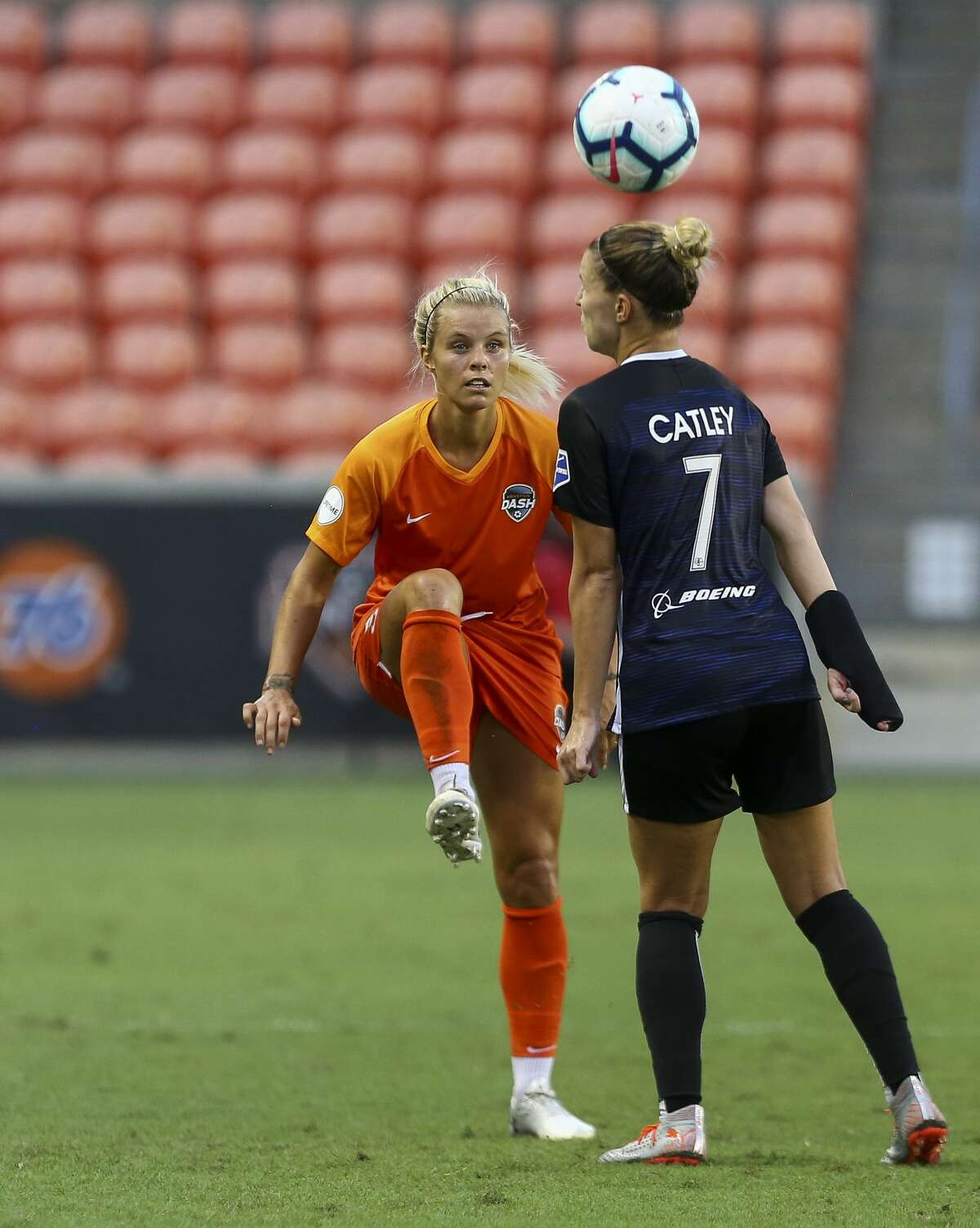 Houston Dash forward Rachel Daly (3) passes the ball to a teammate over Seattle Reign FC defender Steph Catley (7) during the second half of an NWSL match at BBVA Stadium Friday, Aug. 2, 2019, in Houston. Reign FC won 1-0.