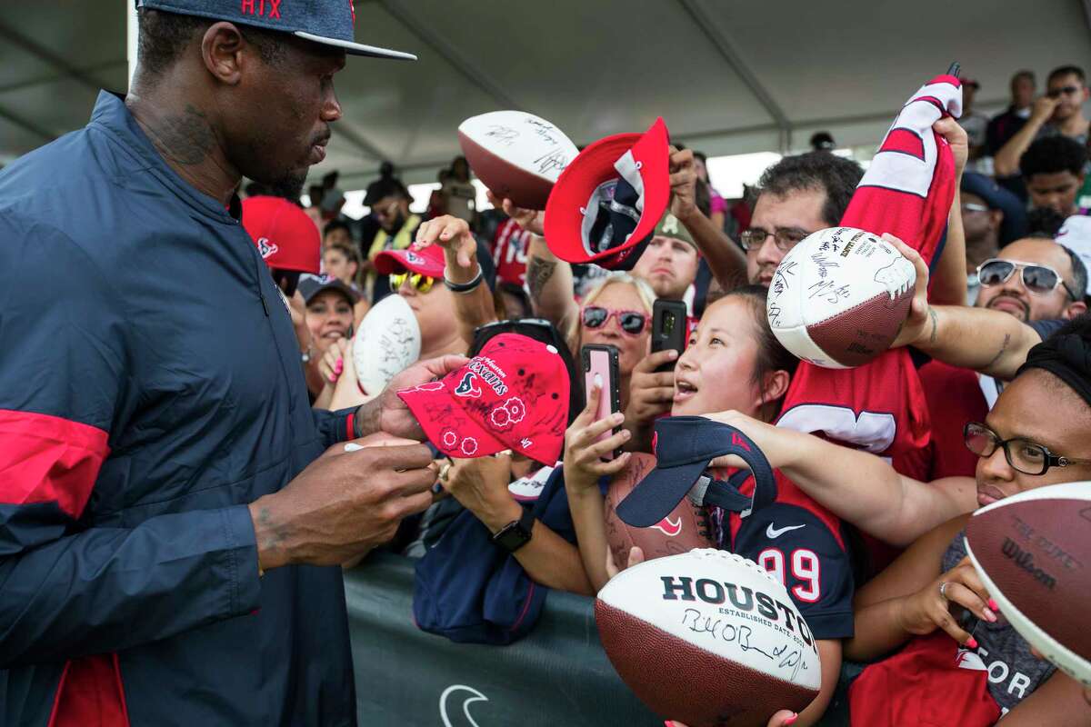 PHOTOS: The rest of the Class of 2019 Gridiron Legends Andre Johnson, former Houston Texans wide receiver and special assistant to the head coach, signs autographs during training camp at the Methodist Training Center on Saturday, Aug. 3, 2019, in Houston.