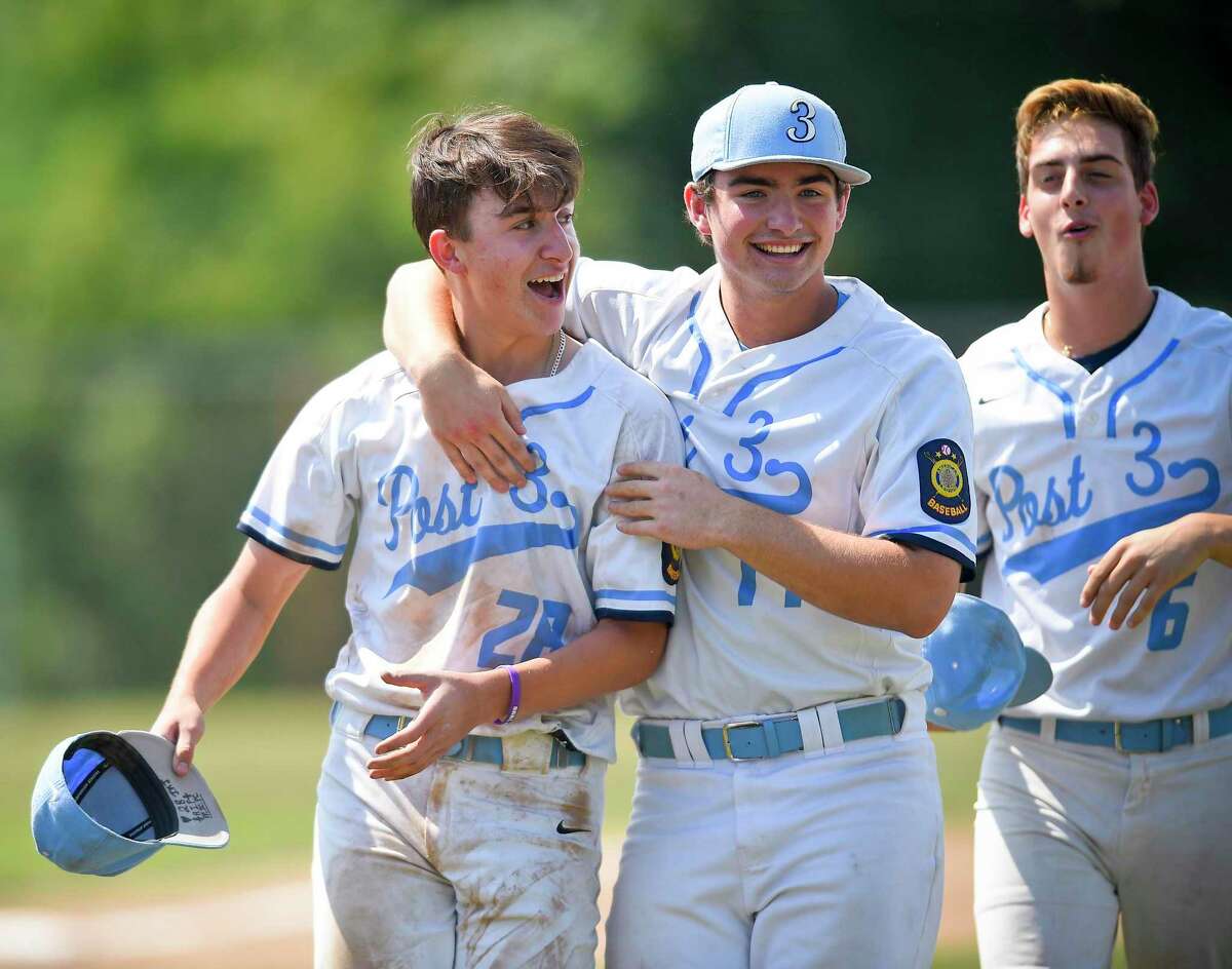 Stamford's Grant Purpura (28) Shane Hackett (14) and Christopher Candito (6) celebrate their 1-0 win against Southington in the Connecticut American Legion Senior Baseball Championship Series at Ceppa Field on Aug. 3, 2019 in Meriden, Connecticut.
