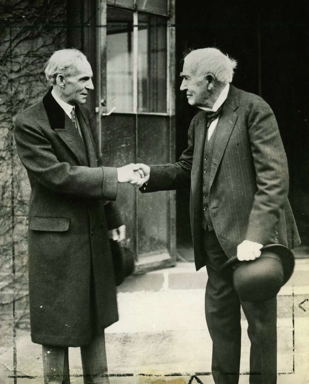 Thomas Edison, right, and Henry Ford shake hands, ca. 1920s. (Wide World Photo/Times Union archive print)