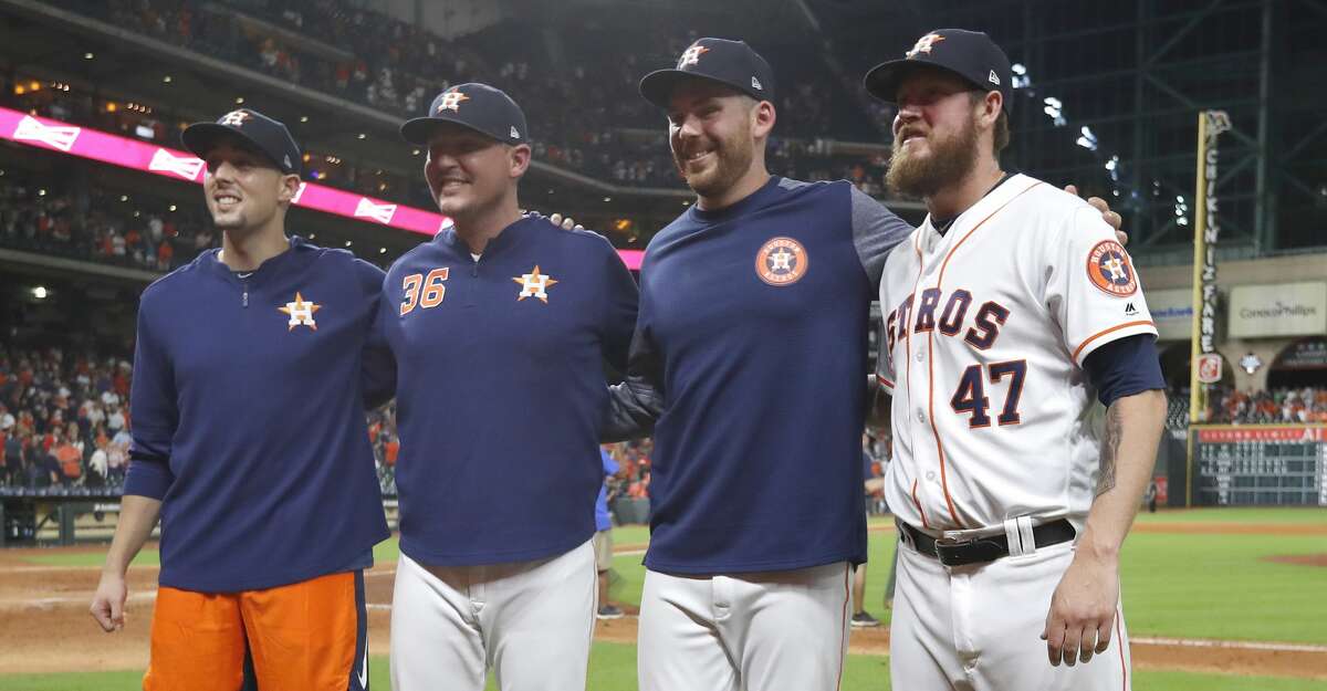 Houston Astros starting pitcher Aaron Sanchez, left, and relief pitchers Will Harris (36), Joe Biagini (29) and Chris Devenski (47) pose after an MLB game at Minute Maid Park, Sunday, August 3, 2019. The Astros pitchers combined for a four-pitcher, no-hitter against the Seattle Mariners, and won the game 9-0.