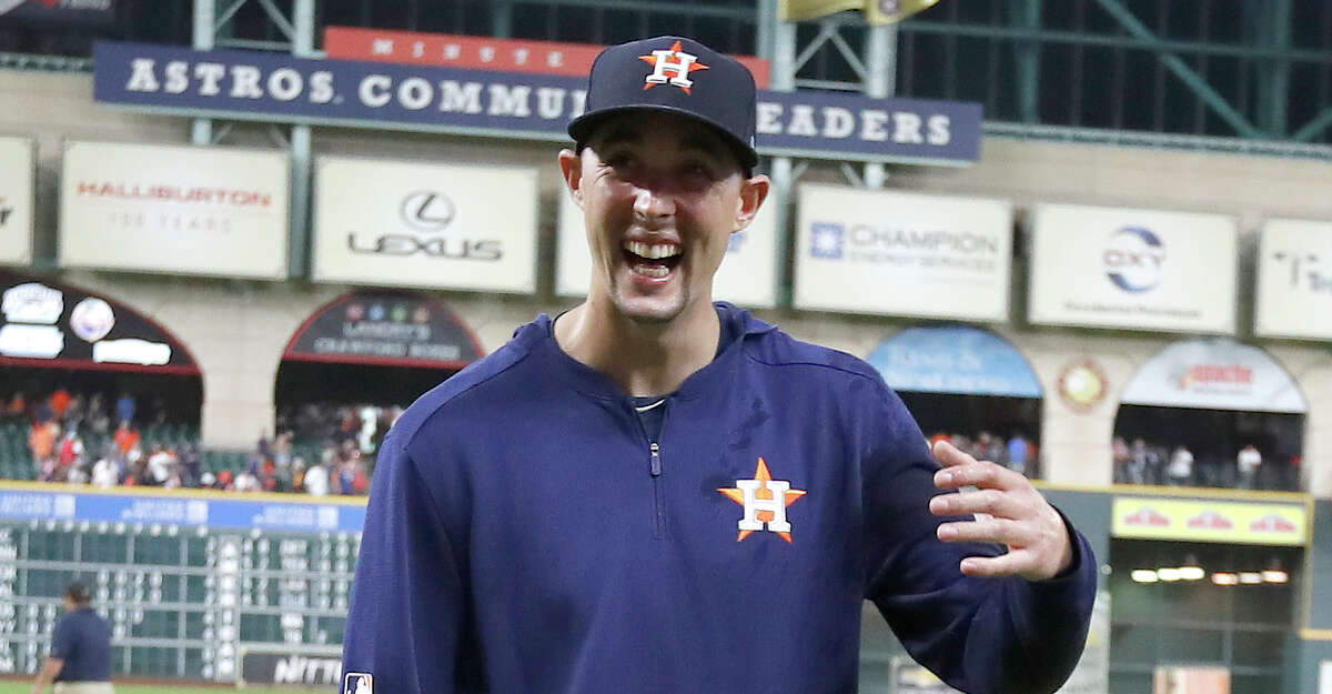 Houston Astros starting pitcher Aaron Sanchez, laughs after posing for photos with relief pitchers Will Harris (36), Joe Biagini (29) and Chris Devenski (47) after an MLB game at Minute Maid Park, Sunday, August 3, 2019. The Astros pitchers combined for a four-pitcher, no-hitter against the Seattle Mariners, and won the game 9-0.