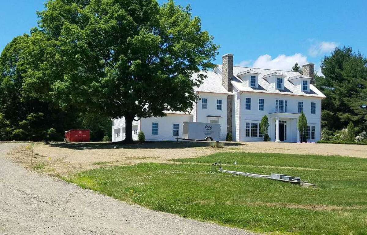 A former employee of Fotis Dulos’ real estate development company, Fore Group, was working at this Sturbridge Hill Road home in New Canaan on May 24. His attorney said police have cleared his client as a suspect after questioning him about driving Fotis Dulos’ truck in New Canaan the day of the disappearance.