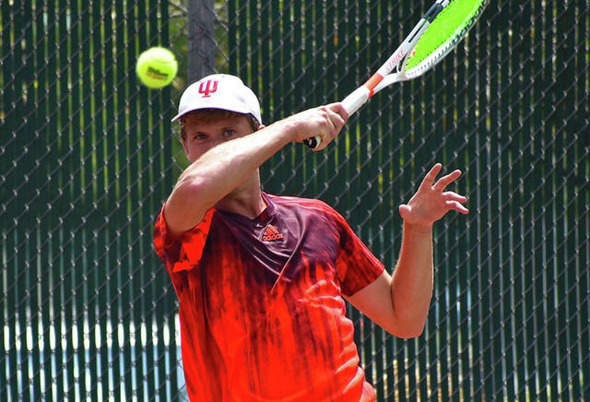 Carson Haskins watches his forehand shot head towards the net in the first set on Saturday in the Pro Wildcard Challenge at the EHS Tennis Center.
