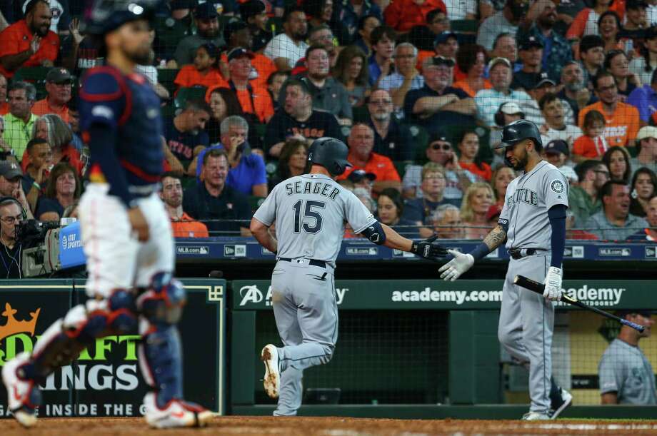 Seattle Mariners third baseman Kyle Seager (15) celebrates with shortstop J.P. Crawford (3) after hitting a home run against the Houston Astros during the seventh inning of an MLB game at Minute Maid Park Sunday, Aug. 4, 2019, in Houston. Photo: Godofredo A Vásquez, Staff Photographer / © 2019 Houston Chronicle