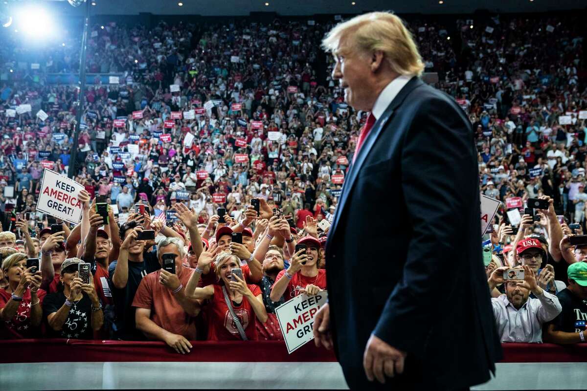 President Donald Trump walks out to speak at a rally in Cincinnati on Thursday.