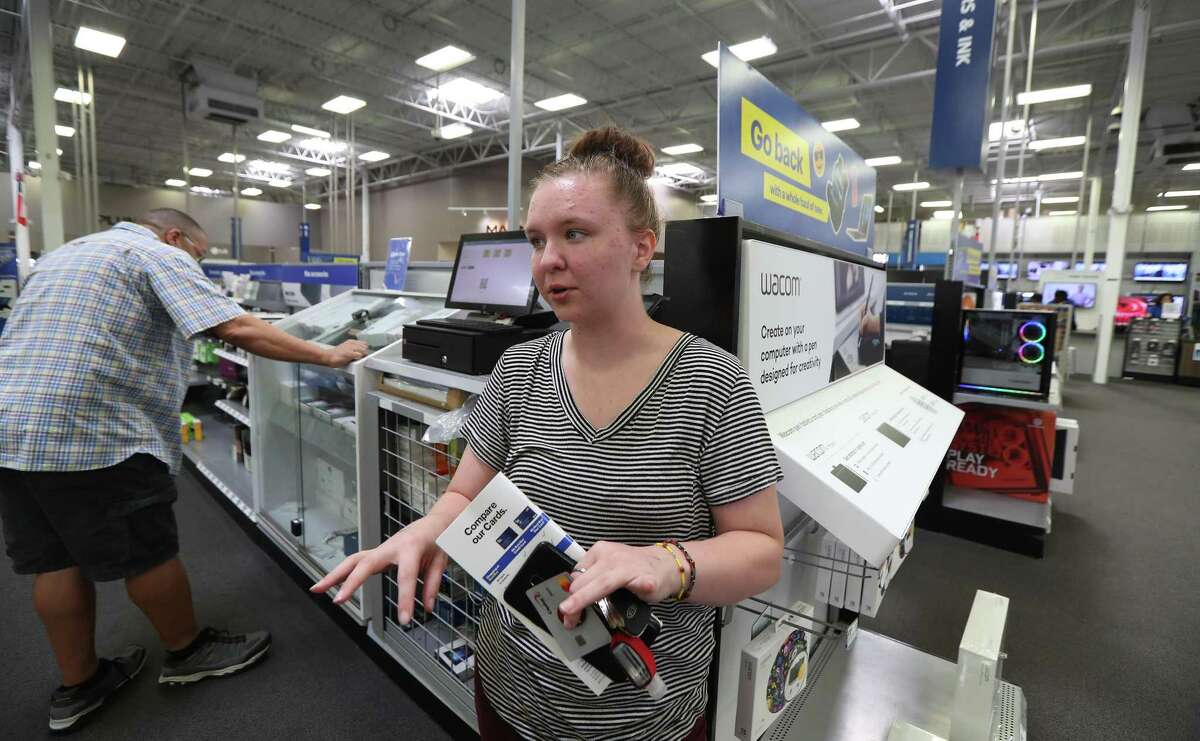 Julie Frazier looked into purchasing a computer during back-to-school shopping at Best Buy Wednesday, July 31, 2019, in Houston.