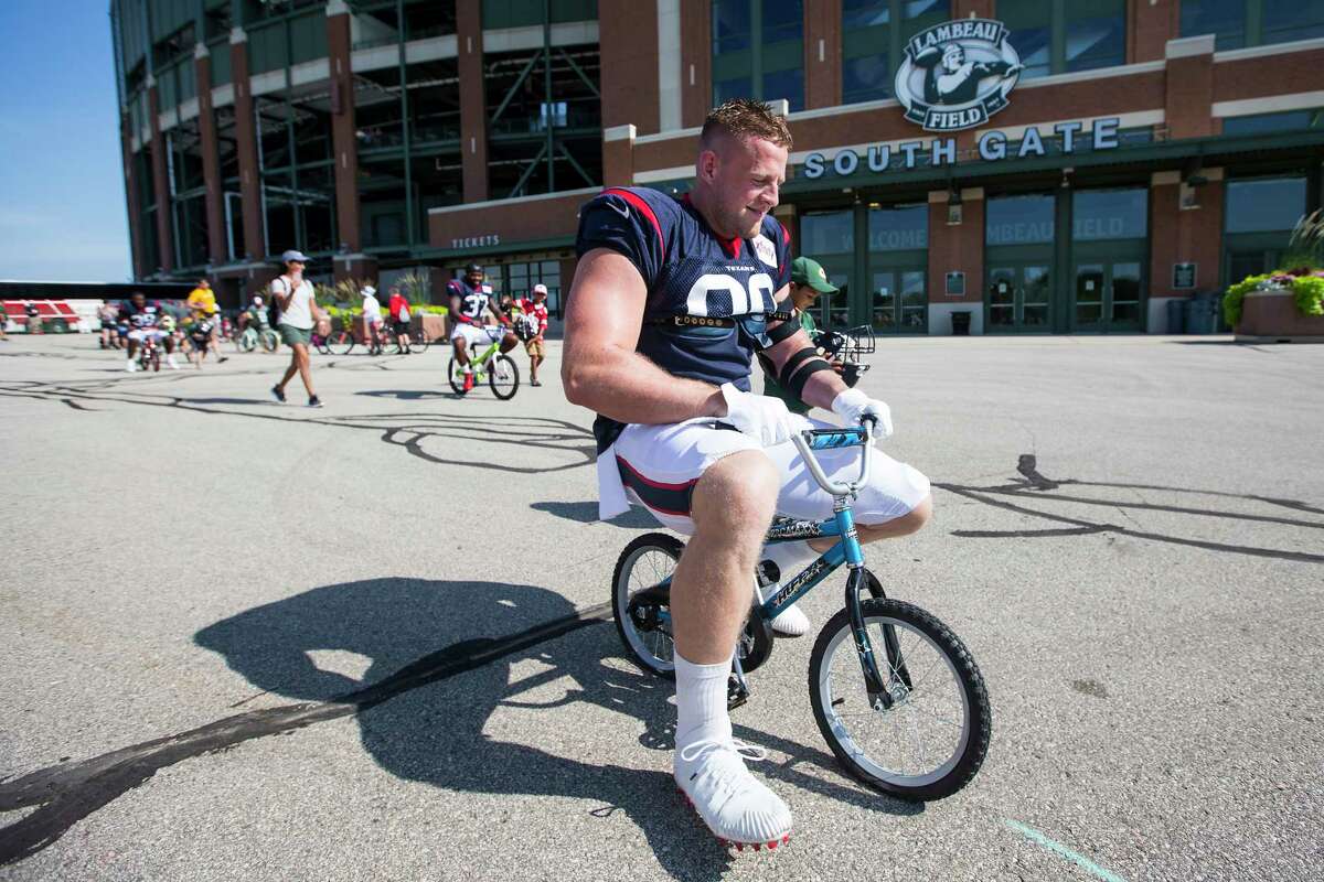 PHOTOS: More of Texans players riding kids' bicycles in Green Bay on Monday Houston Texans defensive end J.J. Watt rides a bike to practice for a joint training camp practice with the Green Bay Packers outside Lambeau Field on Monday, Aug. 5, 2019, in Green Bay.