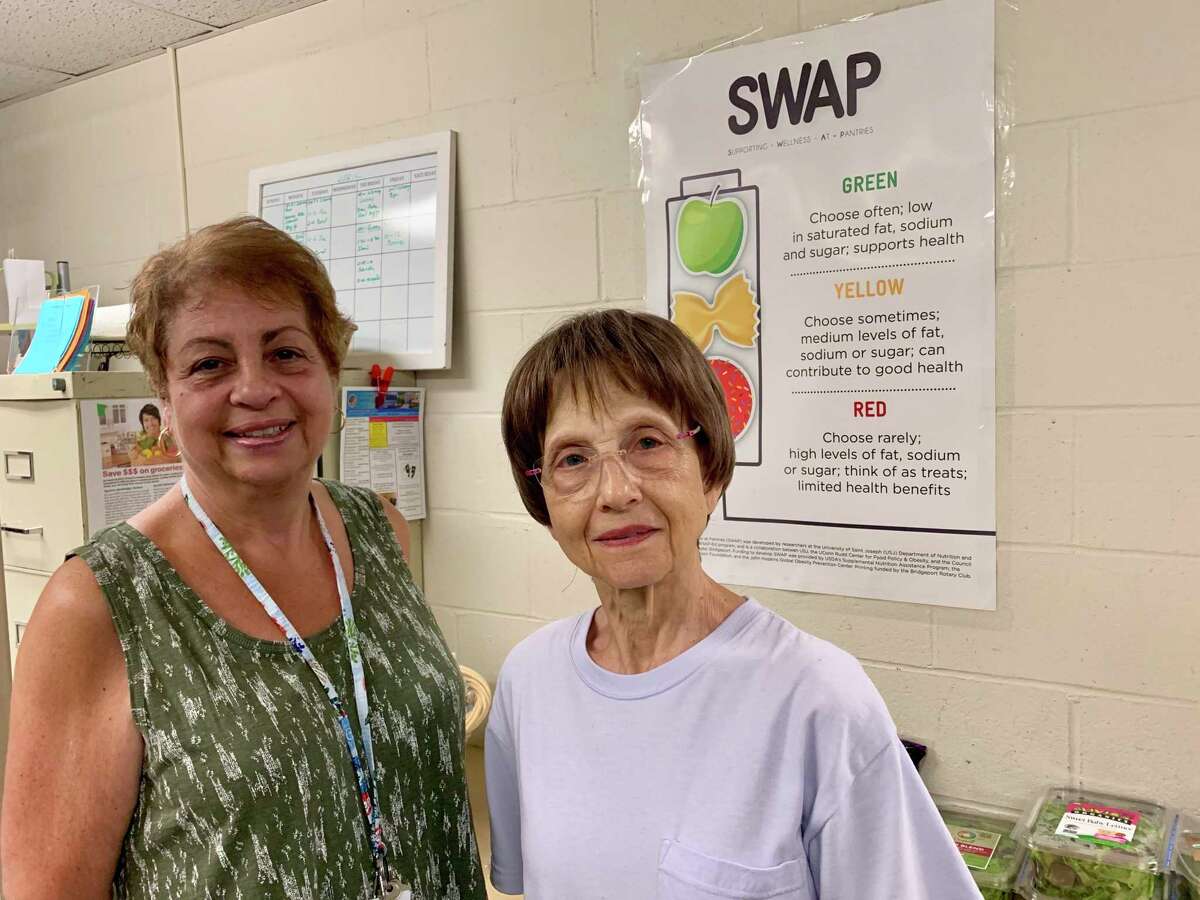 Karen Seferi, food pantry coordinator and Connie Scalise, food pantry volunteer.