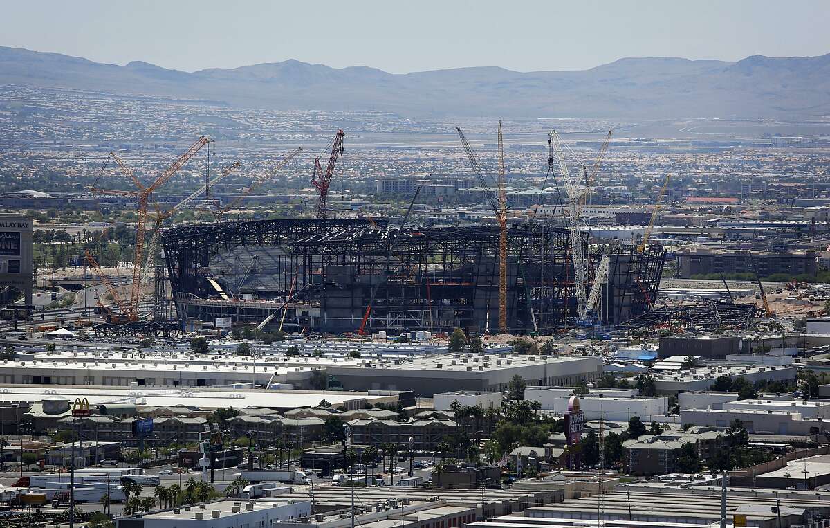 Raiders' Las Vegas stadium gets a name, passes milestone