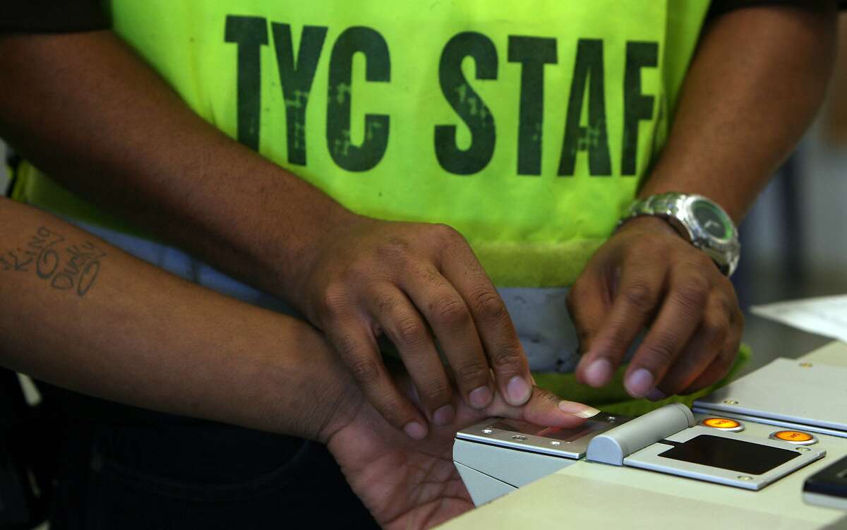 An offender at the Texas Youth Commision's McLennan County State Juvenile Correctional Facility is fingerprinted during his first day there.The minimum age for offenders there is ten years old. JOHN DAVENPORT / STAFF