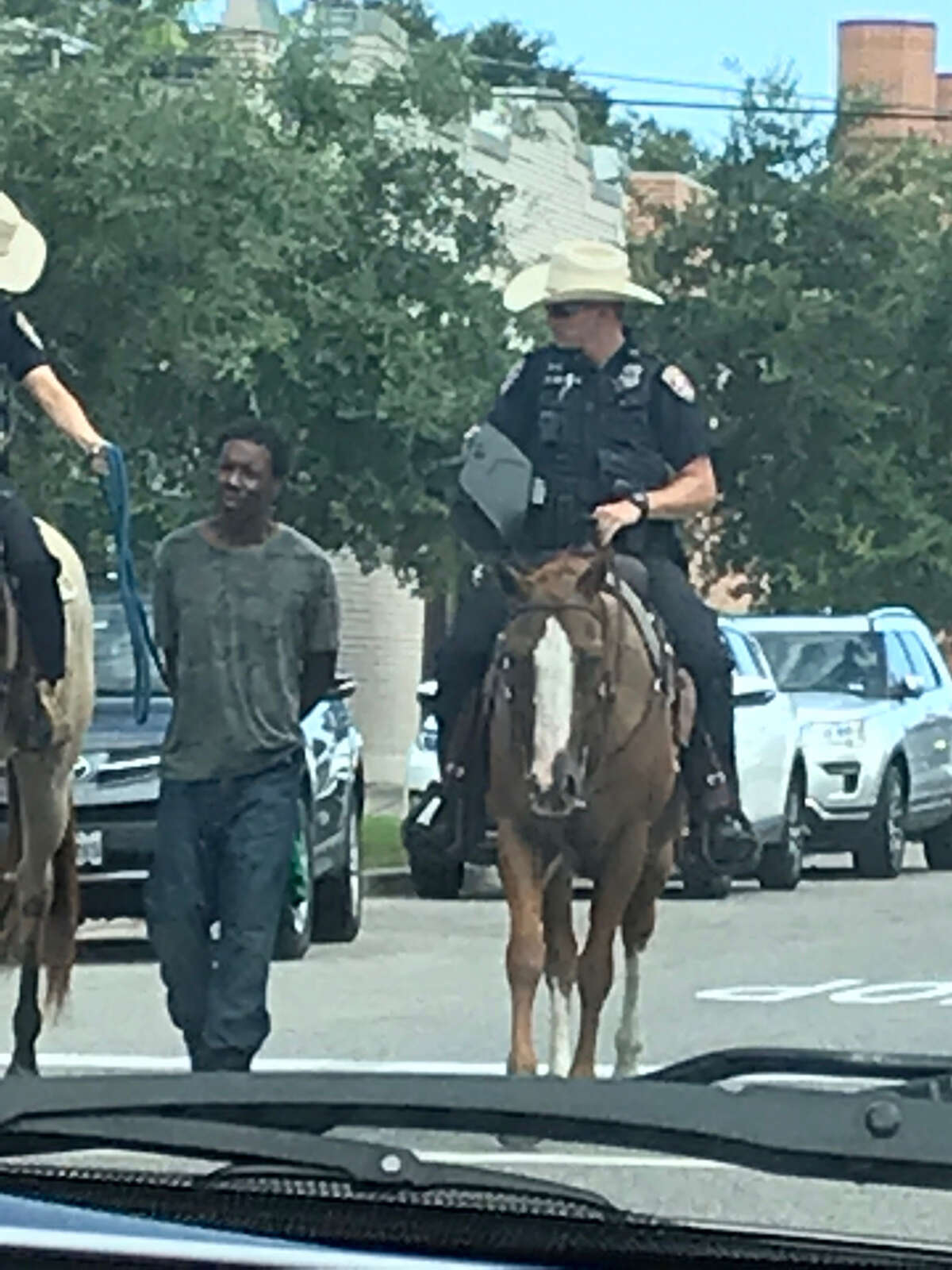 A man is led to jail by two Galveston police officers on horseback on Saturday. >> Click through the following gallery to see recent racist and controversial incidents in Houston and the rest of Texas.