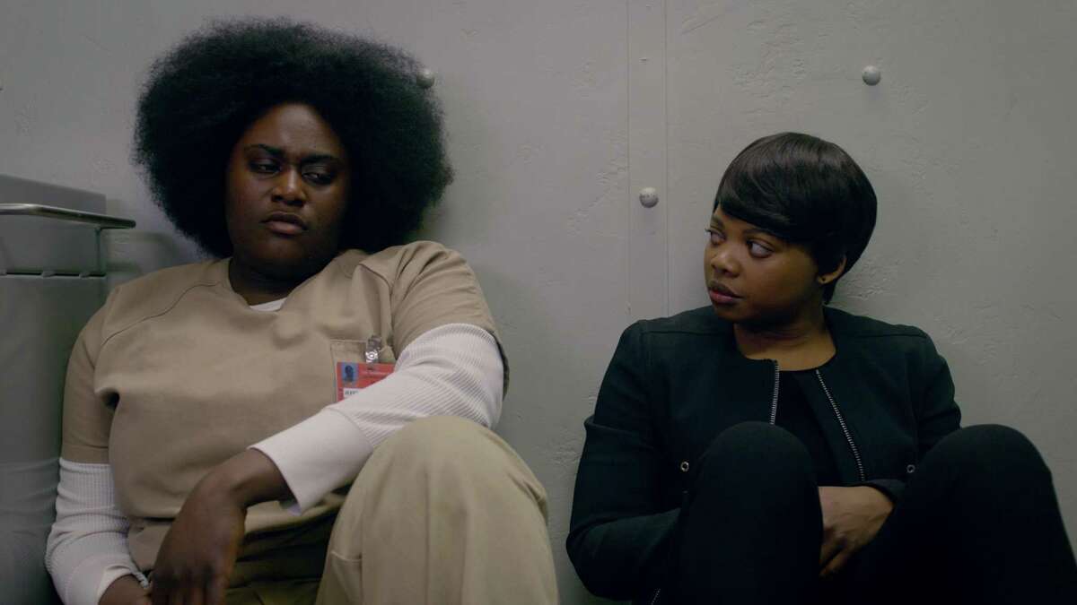 Taystee (Danielle Brooks) and Warden Tamika Ward (Susan Heyward) reminisce about their childhood in “Orange Is The New Black.”