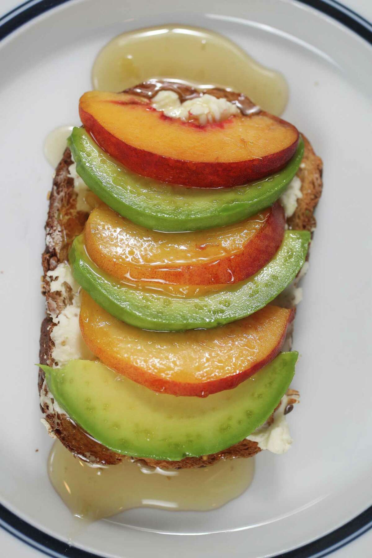 "The 20 Percent Down Payment" is our sweetest avocado toast recipe, topped with honey.