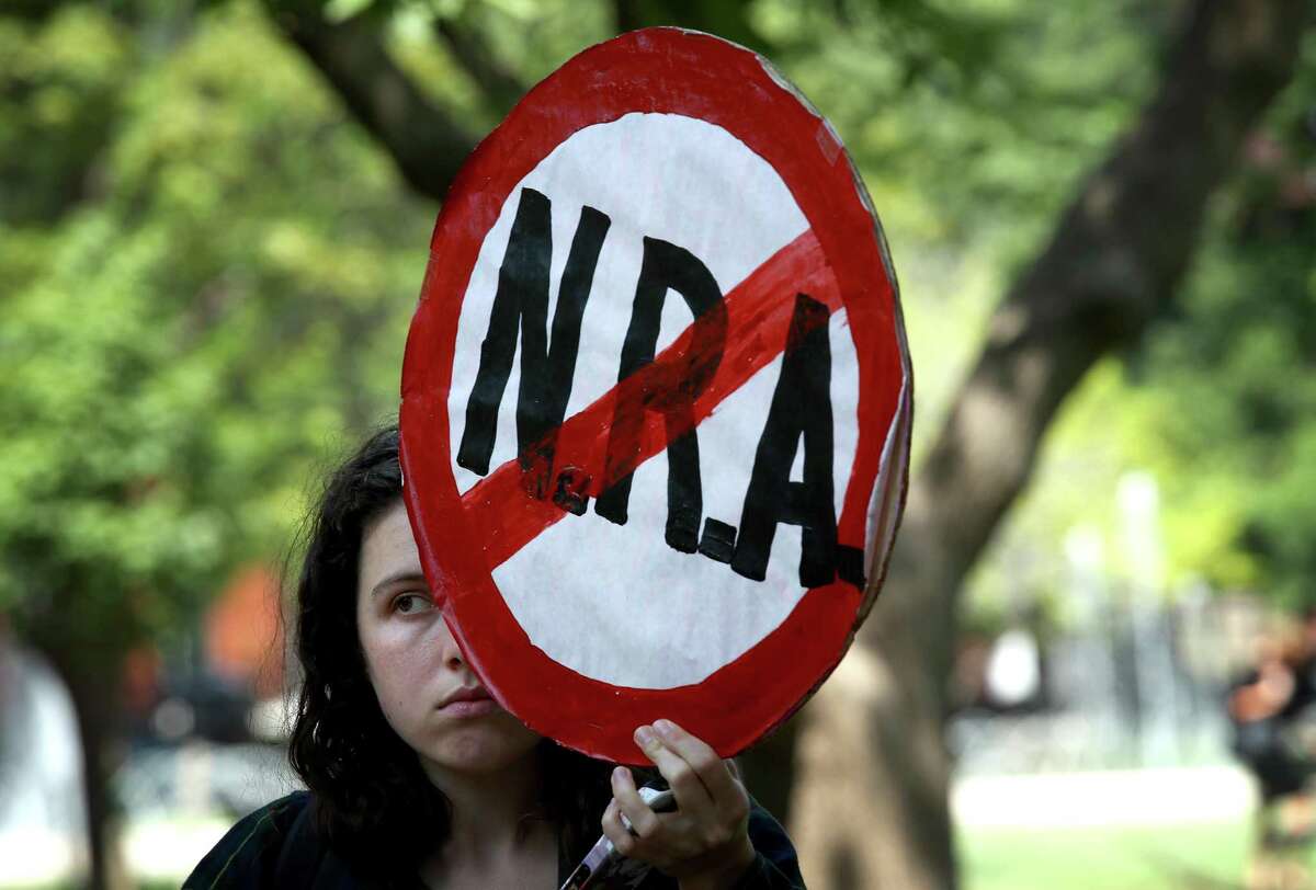 WASHINGTON, DC - AUGUST 06: In the wake of mass shootings in El Paso, Texas and Dayton, Ohio, activists gather in Lafayette Park across from the White House during a gun reform legislation rally sponsored by various protest groups August 6, 2019 in Washington, DC. Activists gathered to demand that Donald Trump cease his racist, violence-inducing attacks on the Latinos, immigrants and communities of color, and to urge the Senate to pass H.R. 8, a bipartisan background checks act passed by the House.(Photo by Win McNamee/Getty Images)