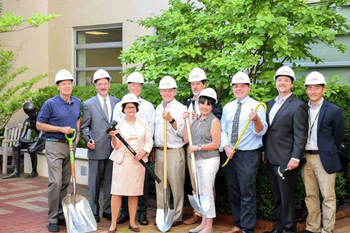 The Greenwich Library’s renovation team poses in the Baxter Courtyard. When completed, the redesigned Baxter Courtyard will serve as an additional primary entrance to the Main Library and lead to a new Café and Center for Education & Culture on the lower level. Pictured, from left, back row: Rob Marks, President, Greenwich Library Board of Trustees; Tom Heagney, Co-Chair, Building Committee; Hank Ashforth, Co-Chair, Building Committee; Andy Fox, Owner’s Representative, Stone Harbor; Michael Tribe, Architect, Peter Gisolfi Associates; Joseph A. Williams, Greenwich Library Deputy Director; Ed Sheeran, Gilbane Building Company; Jae Chu, Gilbane Building Company. Front row: Barbara Ormerod-Glynn, Greenwich Library Director; Patricia Montero, Architectural Designer, Peter Gisolfi Associates.