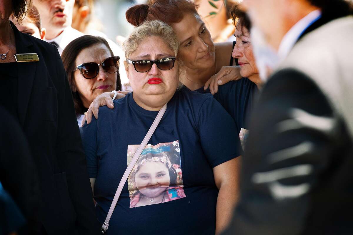 The mother of Keyla Salazar, Lorena Pimentel de Salazar, at center, reacts as the casket is loaded into the hearse at Our Lady of Guadalupe on Tuesday, Aug. 6, 2019, in San Jose, Calif. Keyla Salazar, 13, was a victim of the Gilroy shooting.