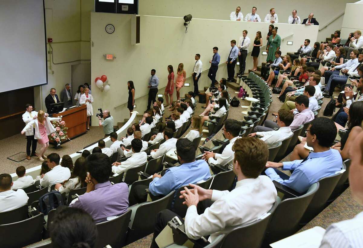 Incoming medical students from the Class of 2023 receive their white medical coat during the White Coat Ceremony at Albany Medical College on Tuesday, Aug. 6, 2019 in Albany, N.Y. (Lori Van Buren/Times Union)