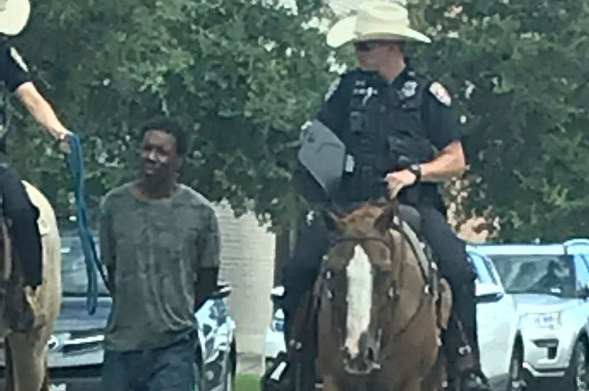 A man is led to jail by two Galveston police officers on horseback on Saturday. On Monday, a statement attributed to Chief Vernon L. Hale III said, "Although this is a trained technique and best practice in some scenarios, I believe our officers showed poor judgment in this instance and could have waited for a transport unit at the location of the arrest."