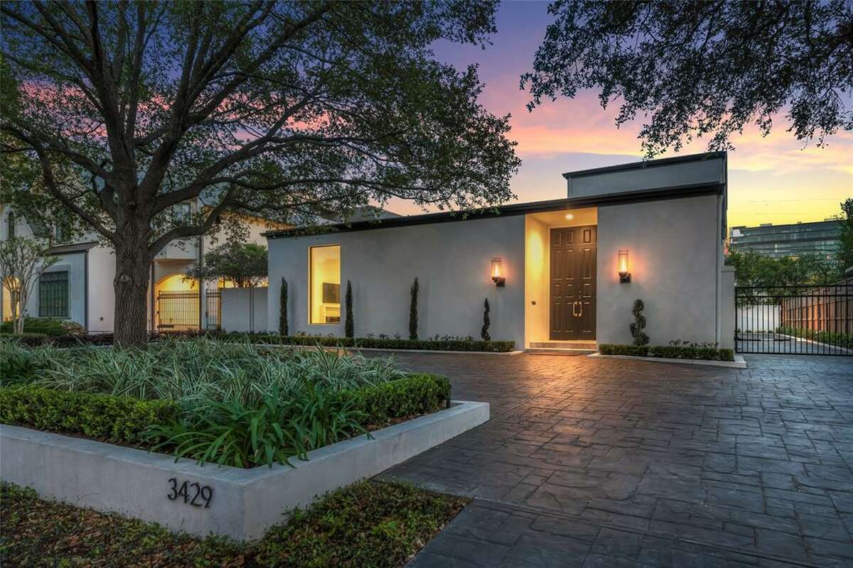 Located at 3429 Ella Lee Lane, this sleek, mid-century modern home was designed by noted architect and longtime civic leader Preston Bolton. The four bedroom, four and a half bathroom home features an open floor plan with soaring ceilings, skylights and walls of sliding glass doors that surround the stunning patio and pool. The original list price was $3,749,000; it is now listed for $3,649,500.