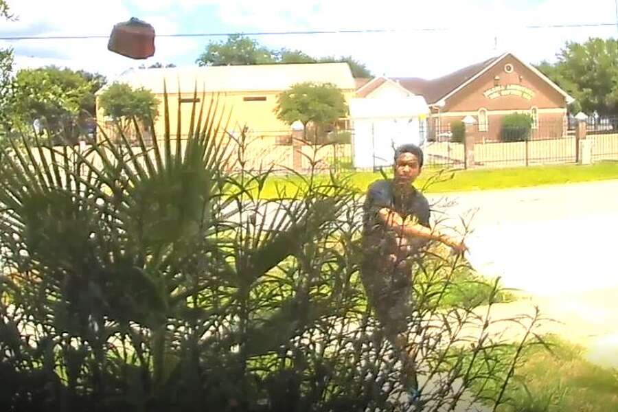 Bizarre video shows man calmly throwing brick through Houston homeowner