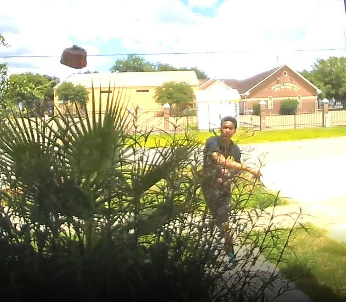 Bizarre video shows man calmly throwing brick through Houston homeowner